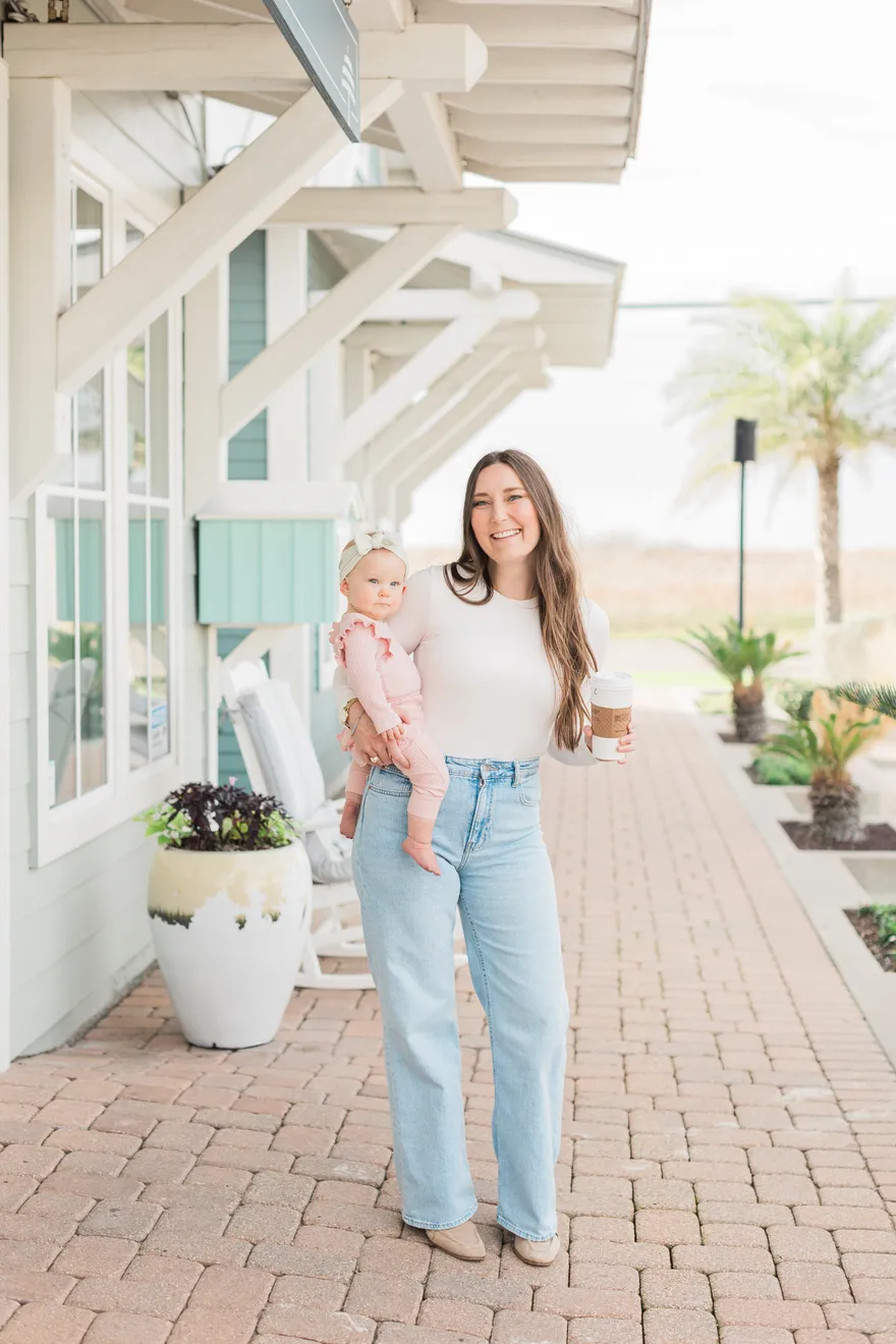 Abby Diane Cooper outdoors, holding her youngest